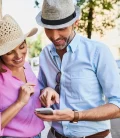 Couple using phone for navigation