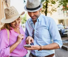 Couple using phone for navigation