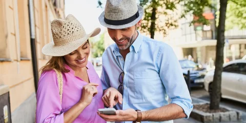 Couple using phone for navigation