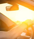 a person driving in a mexican road at sunset