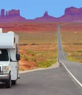 An RV driving on a scenic road