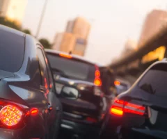 A traffic jam on a busy road in Mexico, with cars lined up and waiting