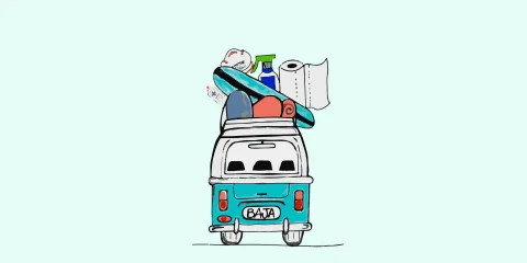 A cartoon of a van packed and ready for a road trip, with luggage on top