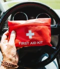 A first aid kit neatly stored inside a car, ready for emergencies.