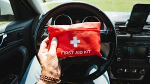 A first aid kit neatly stored inside a car, ready for emergencies.