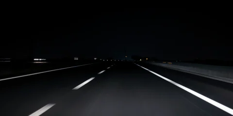 A quiet road in Mexico illuminated by the soft glow of streetlight