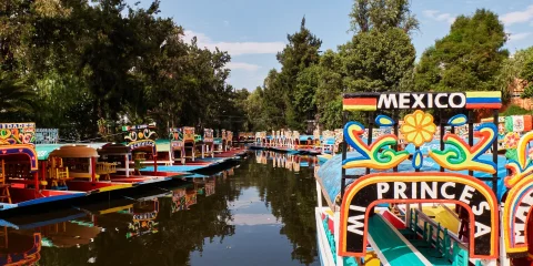 Colorful trajineras floating along the canals of Xochimilco in Mexico City