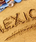 The word 'Mexico' beautifully written in the sand on a beach