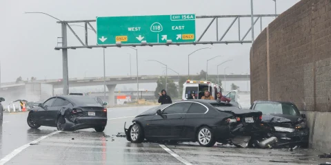 A car accident on the highway with emergency vehicles at the scene