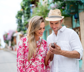 AmericCouple using their cell phone